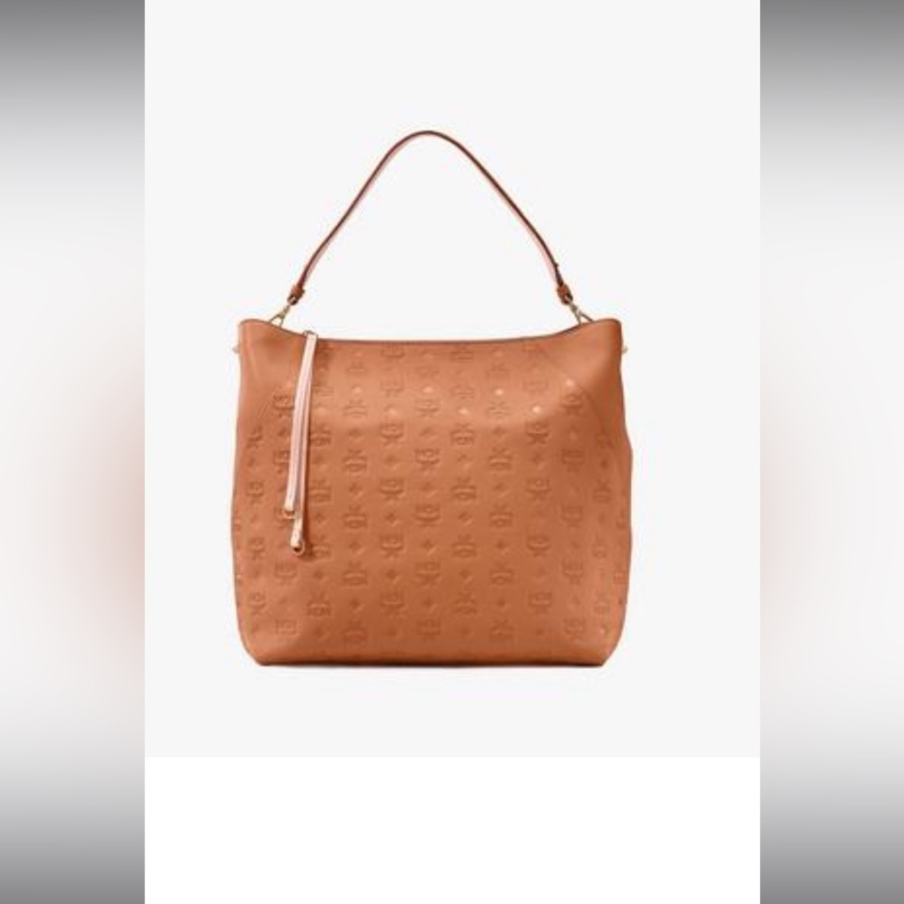 Authentic Cognac Debossed with the MCM emblem and made of supple leather